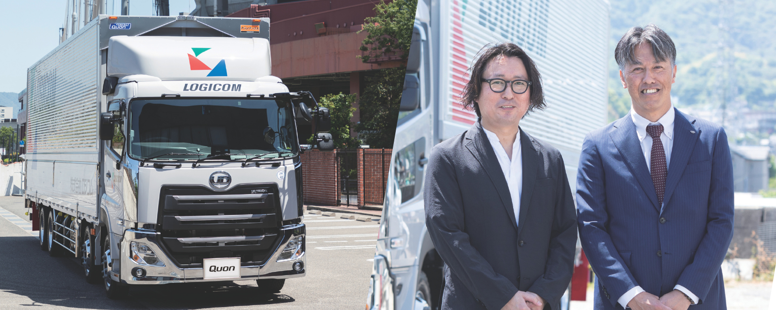 大型トラックとスーツ姿の男性二人が屋外で並んでいる