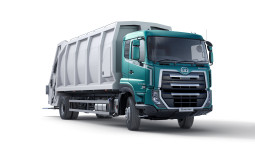 Green and white garbage truck on a white background.